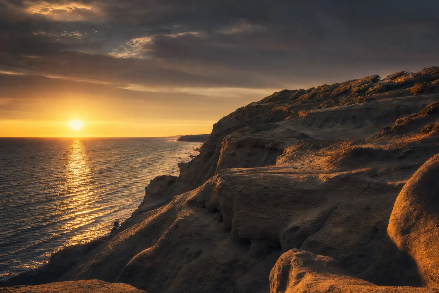 Sandstone bluffs above the Pacific near San Diego at sunset.