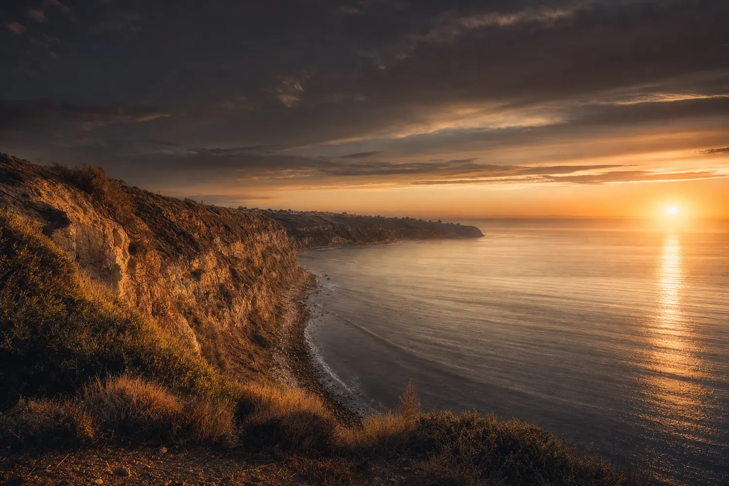 The Palos Verdes bluffs above the South Bay coastline at sunset.