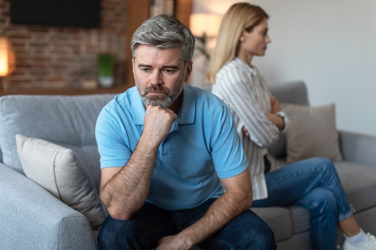 unhappy middle aged man with a woman